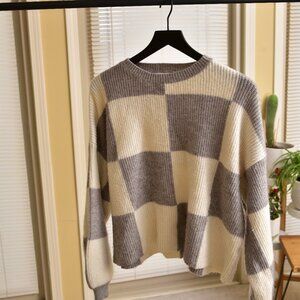 gray and white checkered sweater